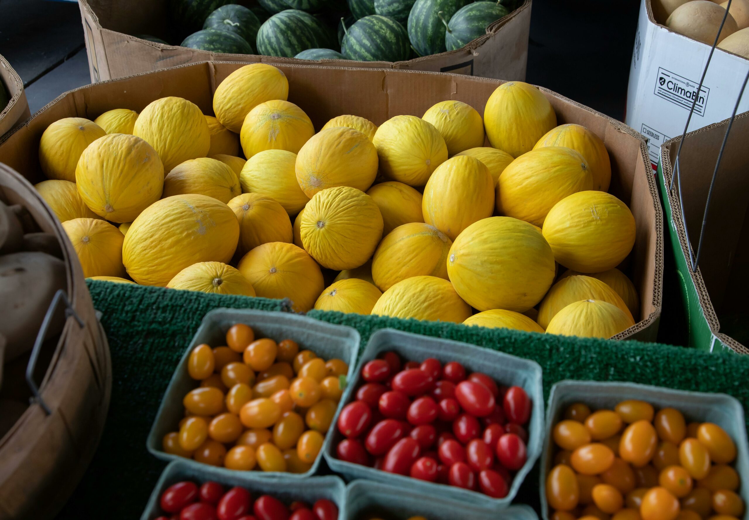 Picture of fruits and vegetables in boxes.